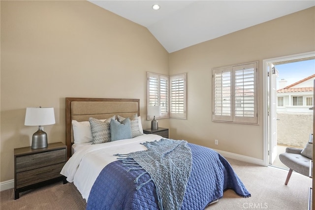 carpeted bedroom with vaulted ceiling