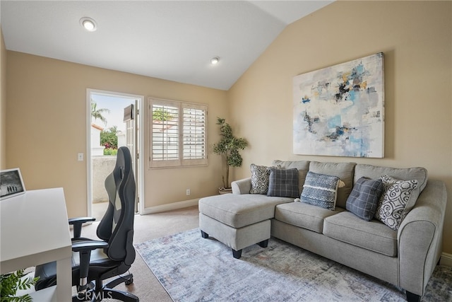 home office with lofted ceiling and carpet flooring