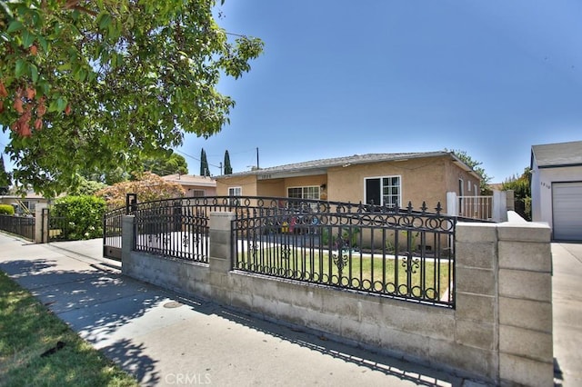 view of gate featuring a fenced front yard