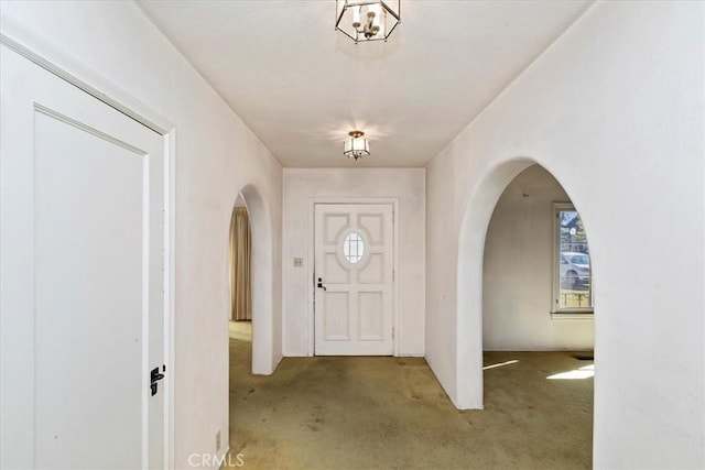 view of carpeted entrance foyer