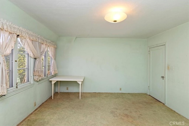 unfurnished room with light colored carpet