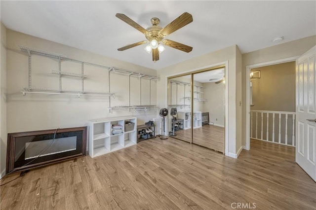 washroom with ceiling fan and light wood-type flooring