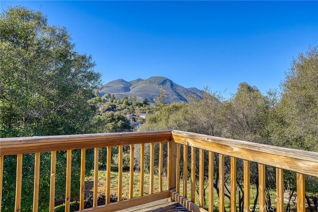 wooden deck with a mountain view