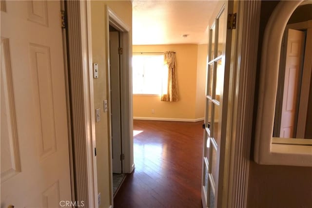 corridor featuring dark hardwood / wood-style floors