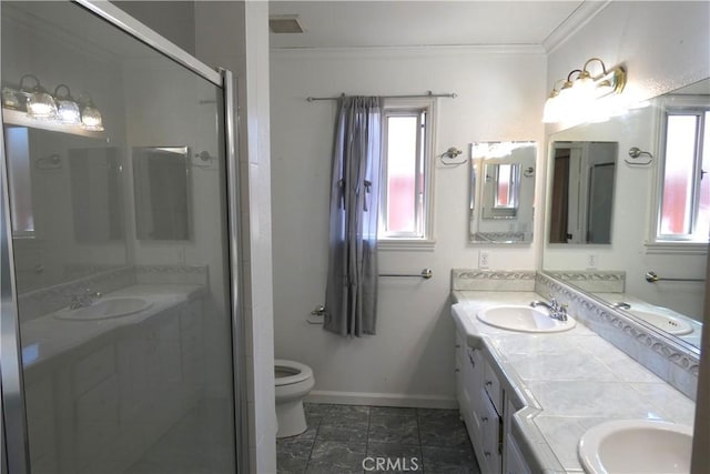 full bathroom with a sink, a shower stall, crown molding, and double vanity