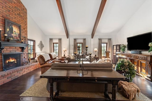 living room with lofted ceiling, dark hardwood / wood-style flooring, and a brick fireplace