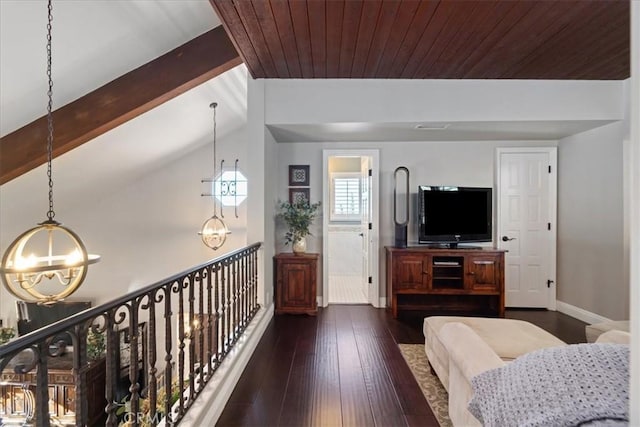 living room featuring vaulted ceiling with beams, a chandelier, wood ceiling, and dark hardwood / wood-style flooring