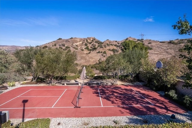 view of sport court with a mountain view