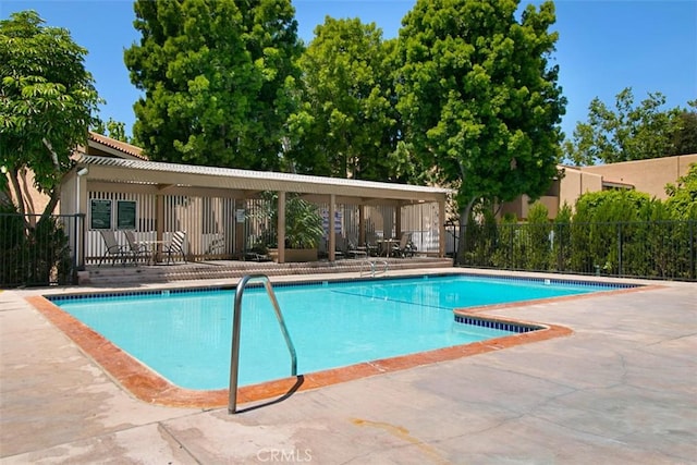 view of swimming pool with a patio