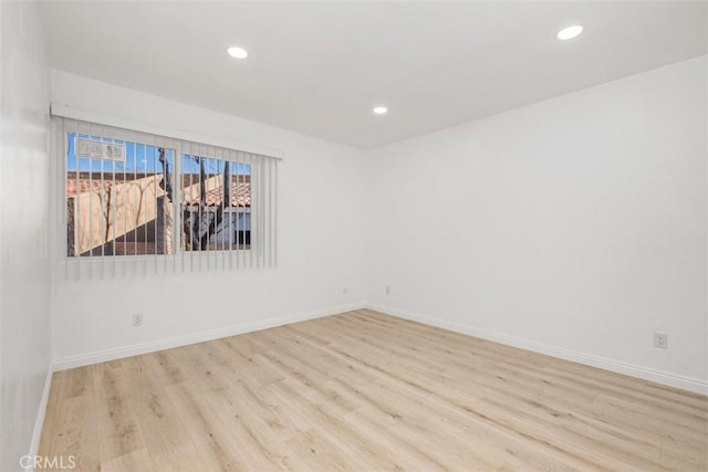 empty room with light hardwood / wood-style floors