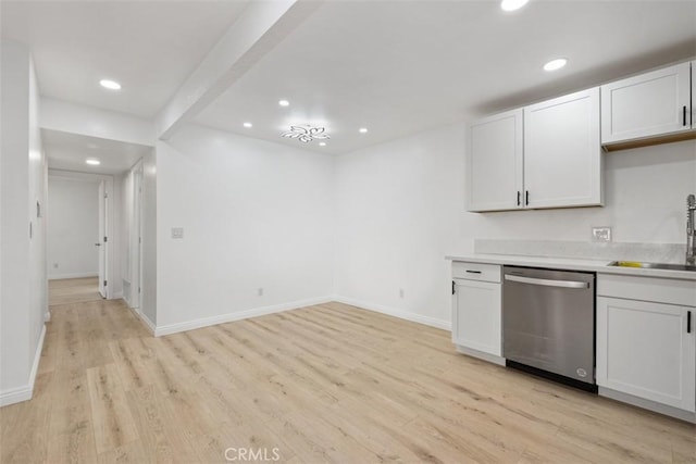 kitchen with sink, light wood-type flooring, dishwasher, beam ceiling, and white cabinets