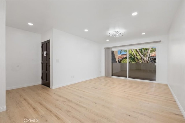 empty room with light hardwood / wood-style floors