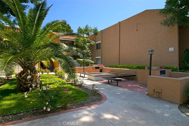 view of home's community with a patio area