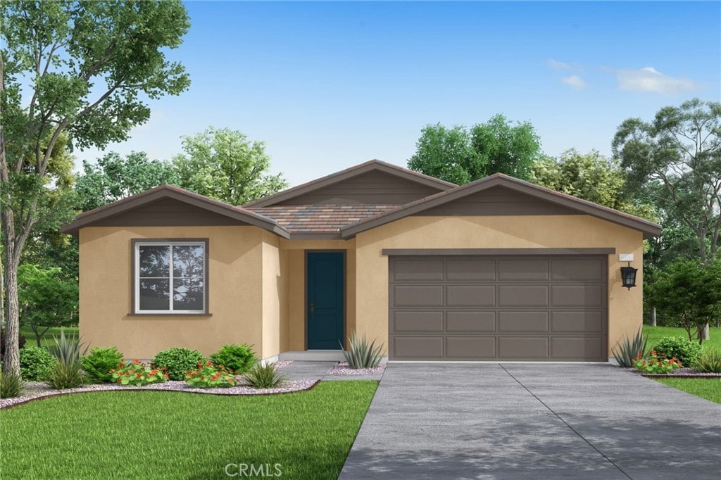 ranch-style home featuring a garage and a front yard