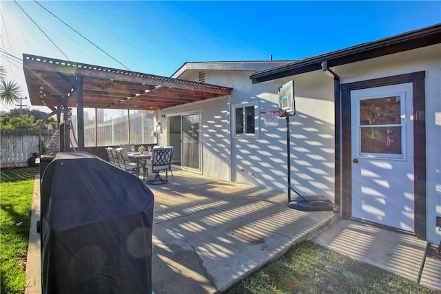 view of patio / terrace with area for grilling and a pergola