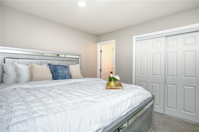 carpeted bedroom featuring a closet