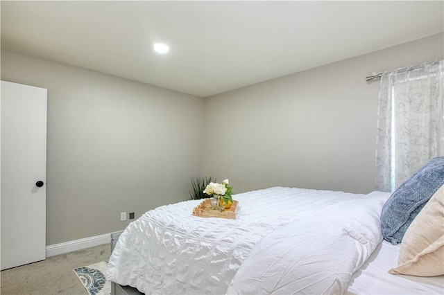 bedroom featuring light colored carpet