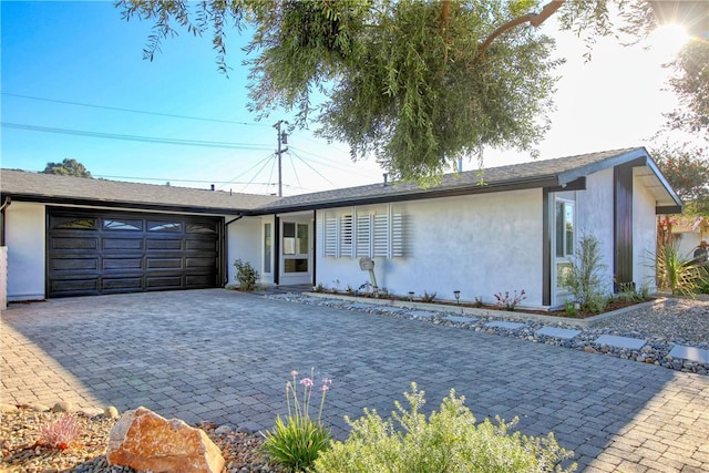 single story home with a garage