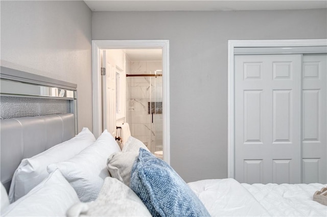 bedroom featuring ensuite bathroom and a closet