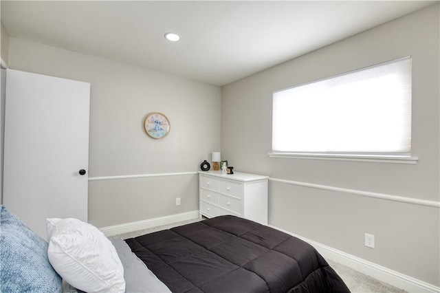 bedroom featuring multiple windows and carpet floors