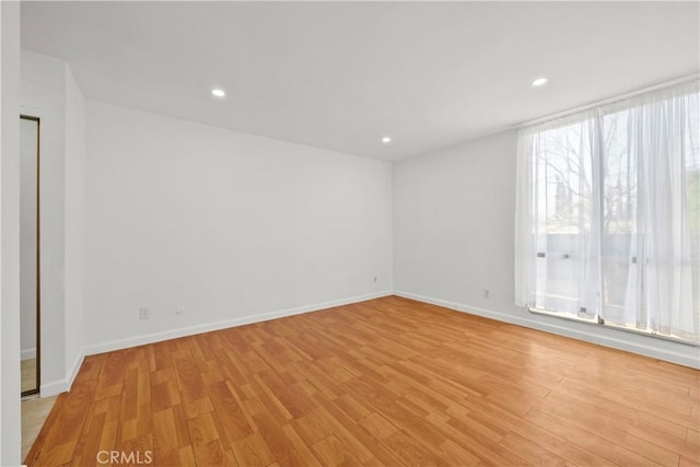 unfurnished room featuring light wood-type flooring