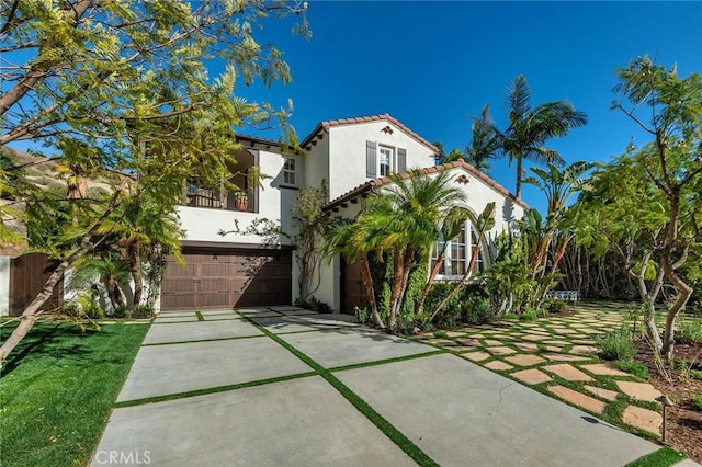 mediterranean / spanish-style house featuring a garage