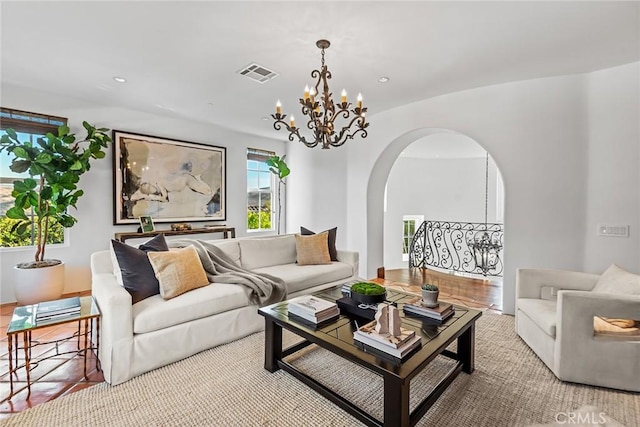 living room featuring a notable chandelier