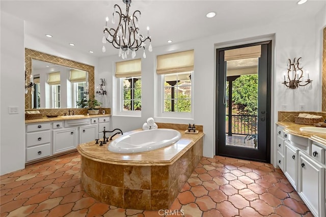 bathroom featuring vanity, a relaxing tiled tub, and decorative backsplash