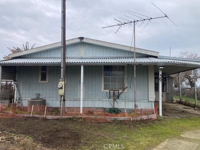 view of home's exterior featuring central AC unit and covered porch