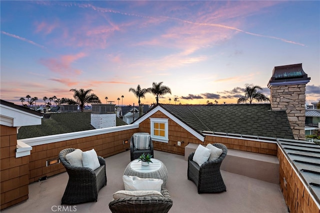 patio terrace at dusk with an outdoor living space