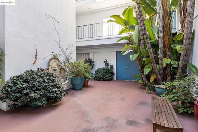 view of patio with a balcony