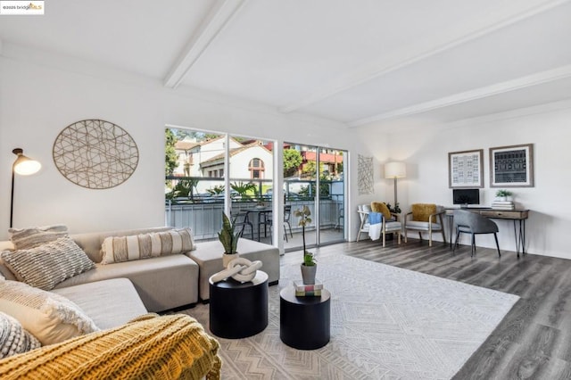 living room featuring beam ceiling and hardwood / wood-style flooring