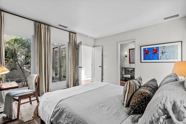 bedroom with wood-type flooring