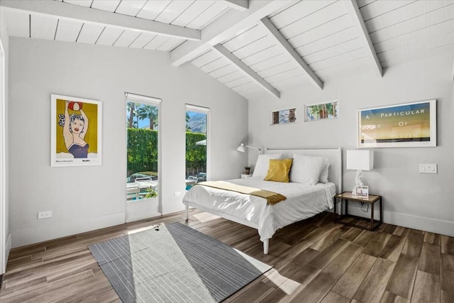 bedroom featuring lofted ceiling with beams, access to exterior, and hardwood / wood-style floors