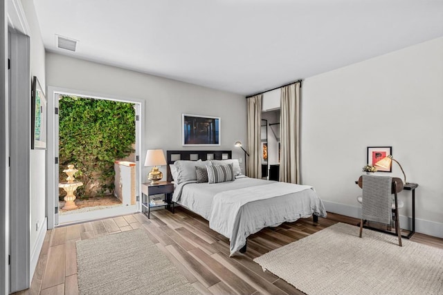 bedroom featuring wood-type flooring