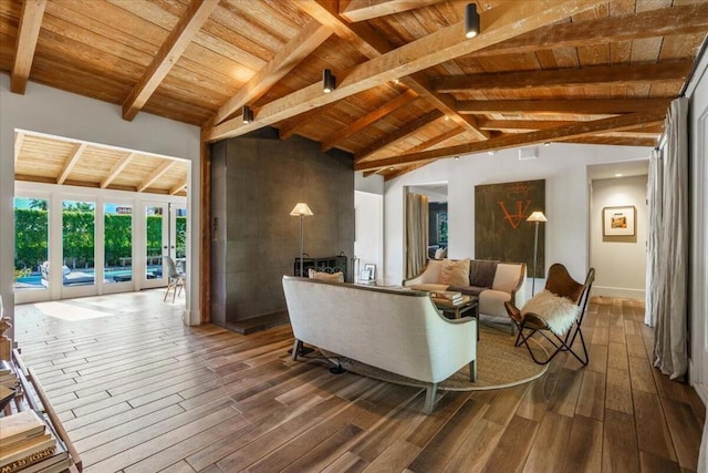 living room with hardwood / wood-style flooring, wooden ceiling, french doors, and beamed ceiling