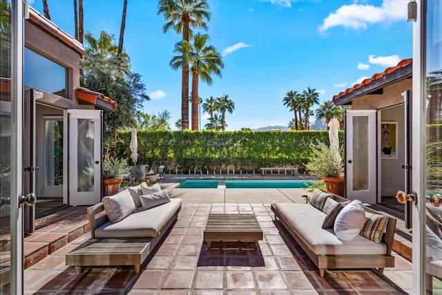 view of patio with a fenced in pool and outdoor lounge area