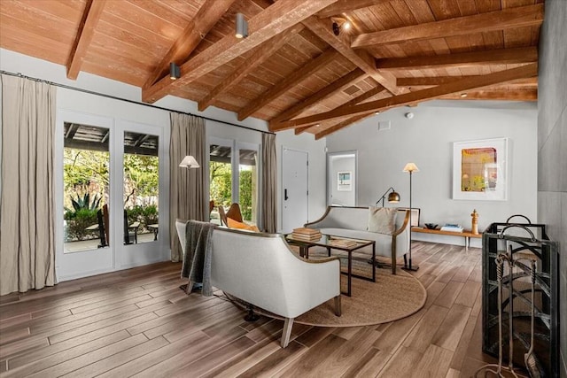 interior space with vaulted ceiling with beams and wood ceiling