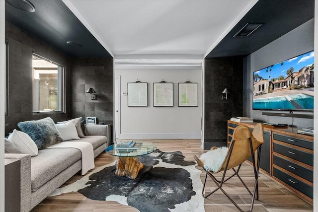 home theater room featuring hardwood / wood-style floors