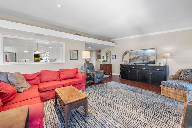 living room with crown molding and dark hardwood / wood-style floors