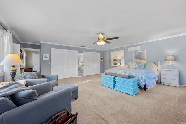 carpeted bedroom featuring ornamental molding, two closets, a wall mounted AC, and ceiling fan