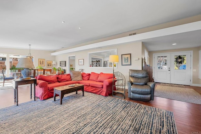 living room with french doors and hardwood / wood-style floors