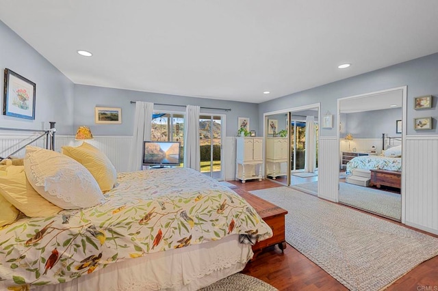 bedroom featuring dark hardwood / wood-style floors and access to outside