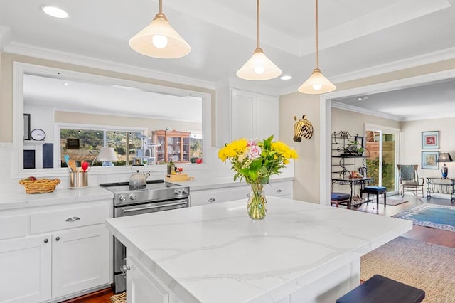 kitchen featuring light stone counters, decorative light fixtures, white cabinets, and stainless steel electric range oven