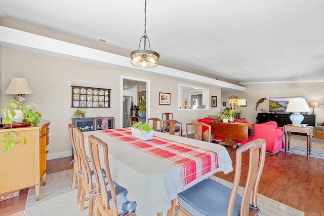 dining area with light hardwood / wood-style floors