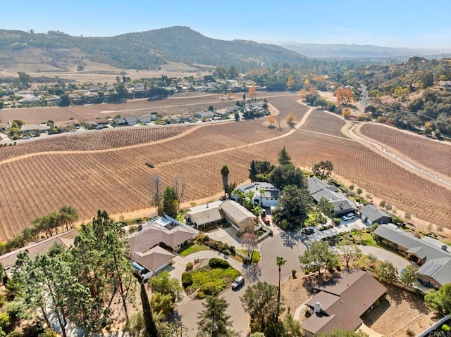 birds eye view of property with a rural view and a mountain view