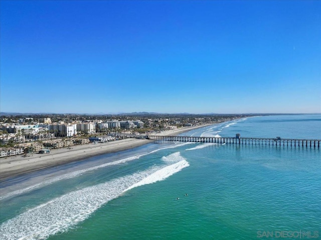 aerial view featuring a water view and a view of the beach