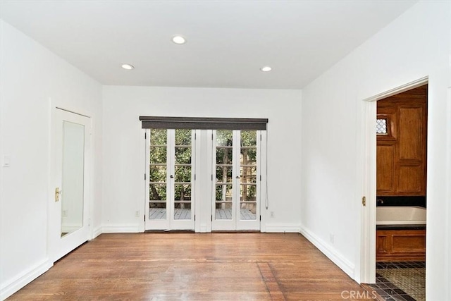 spare room featuring hardwood / wood-style floors