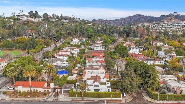 birds eye view of property with a mountain view