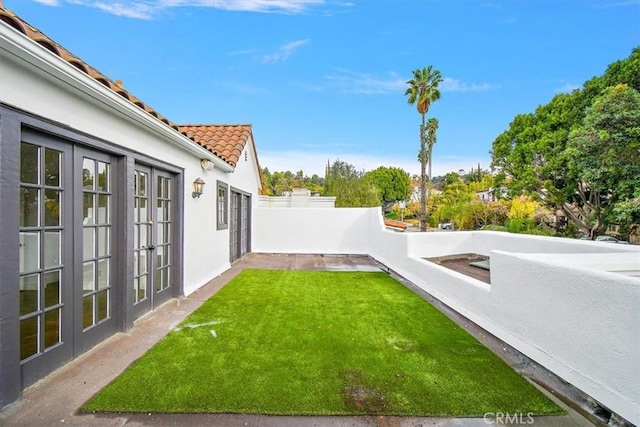 view of yard with french doors